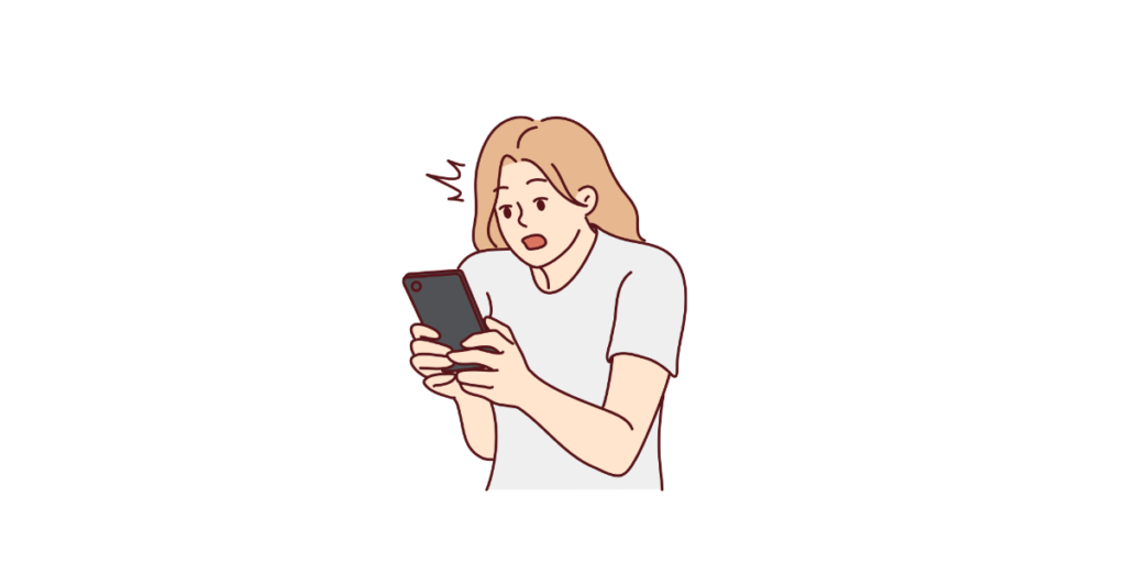 スマホをみて驚いている人